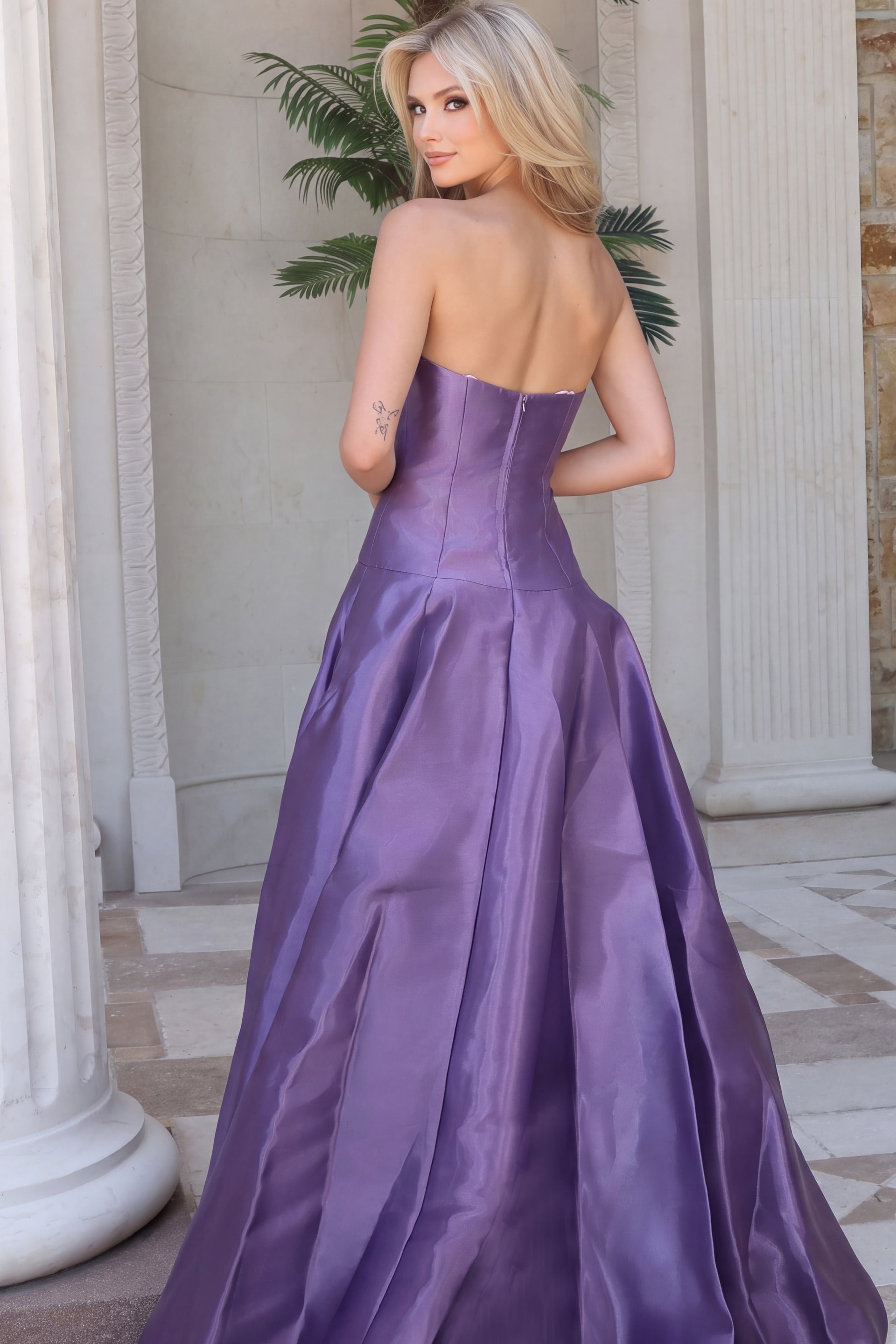 Back view of purple taffeta ball gown showing corset seaming and zip back