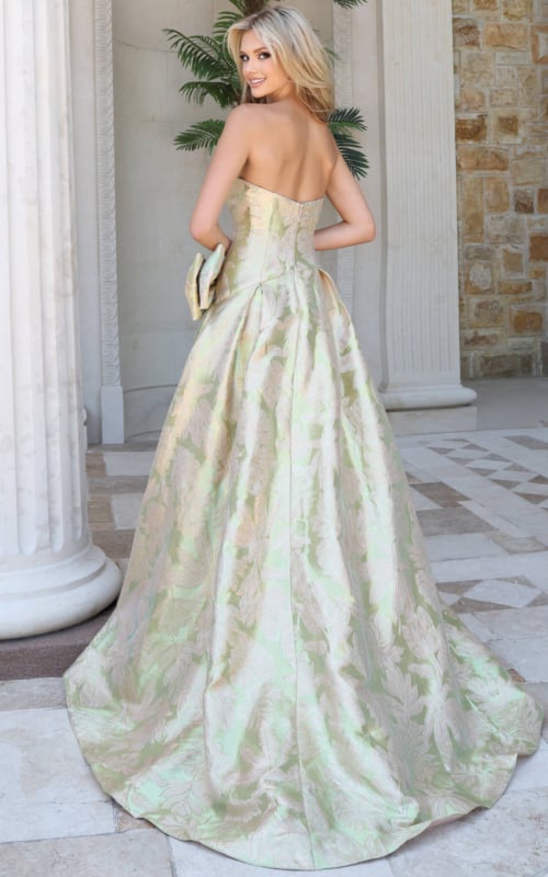 Back view of sage gold brocade ball gown showing closed corset back and full skirt with train