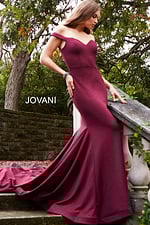Model wearing Jovani 55187 burgundy dress front