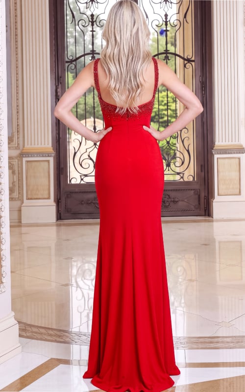 back view of red crepe halter column gown with beaded bodice and high slit