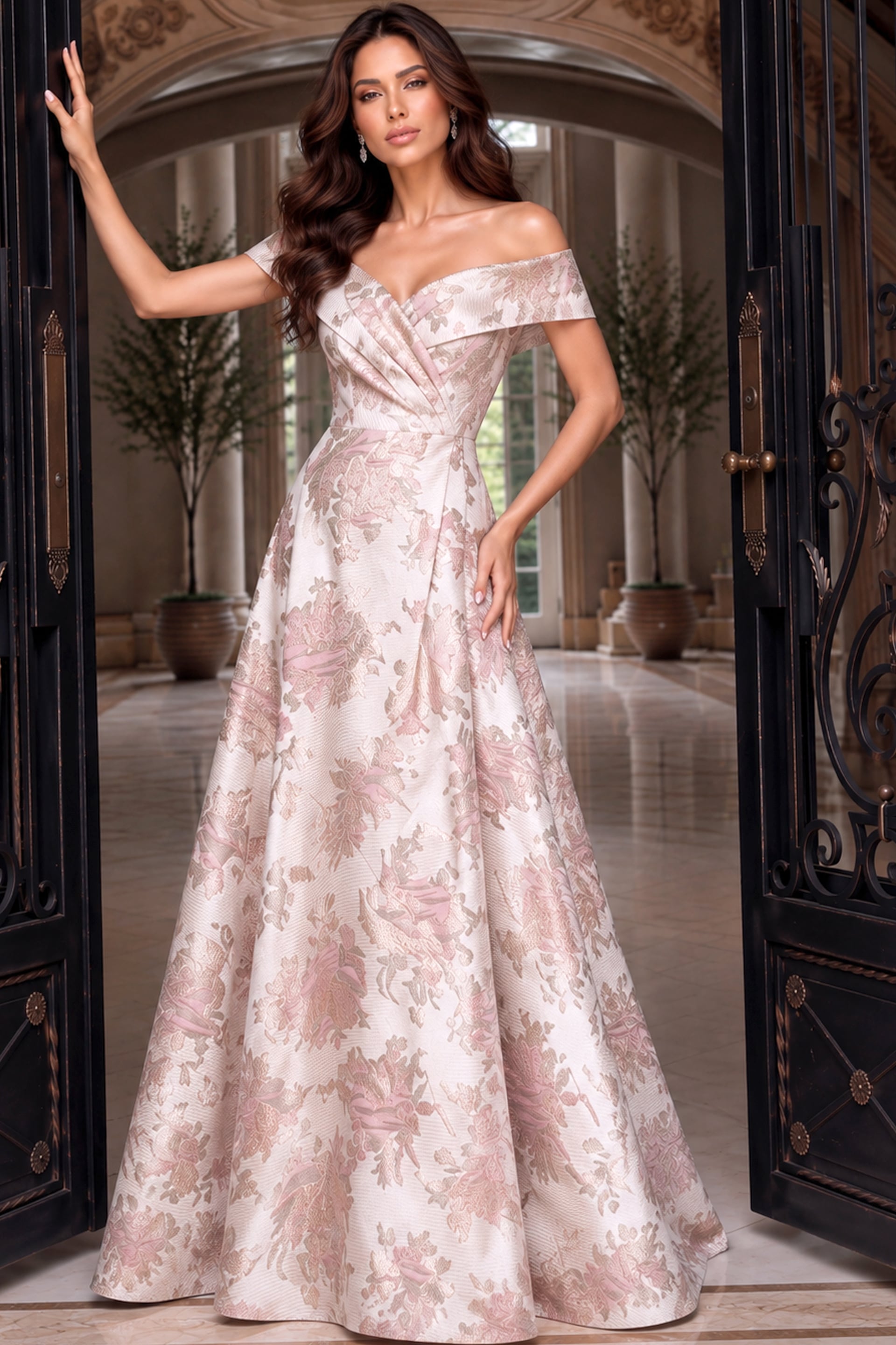 Fold-over off-shoulder neckline and pleated A-line skirt on a blush pink floral brocade gown