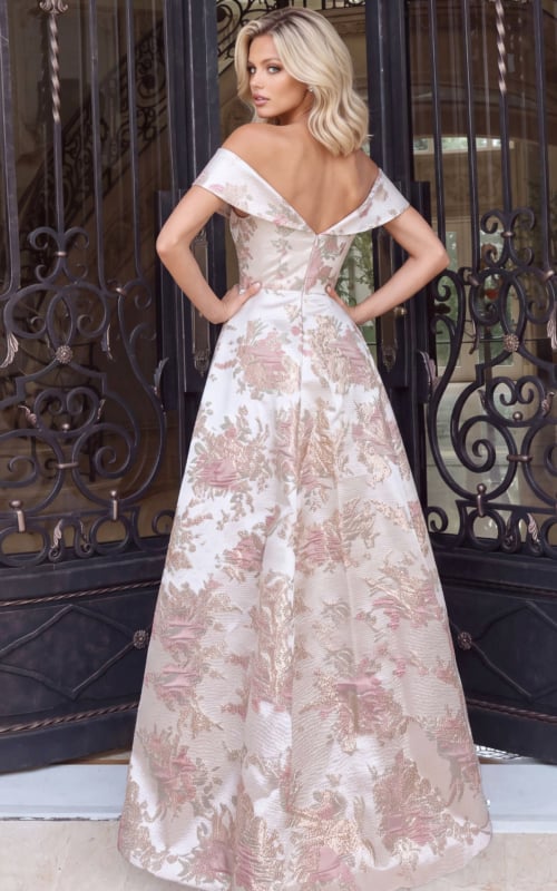 Wide pleated skirt and low V back on a champagne floral jacquard gown, rear view