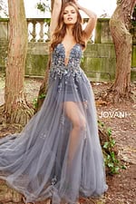Model wearing Jovani 55621 gray gown with floral embellishments and deep V-neckline.