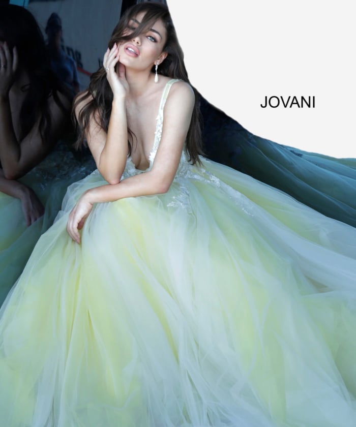 Model sitting in Jovani 55634 off-white yellow dress.