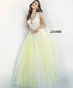 model wearing Jovani 55634 gown in white with yellow and lace applique