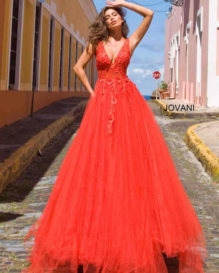 Red Jovani 55634 ball gown with V-neckline and enchanting floral appliques.