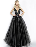 model wearing Jovani 55634 black gown with lace detail