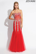 Model in a vibrant Jovani 5908 orange dress with beading.