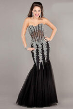 Model elegantly wearing Jovani 5908 black mermaid dress.