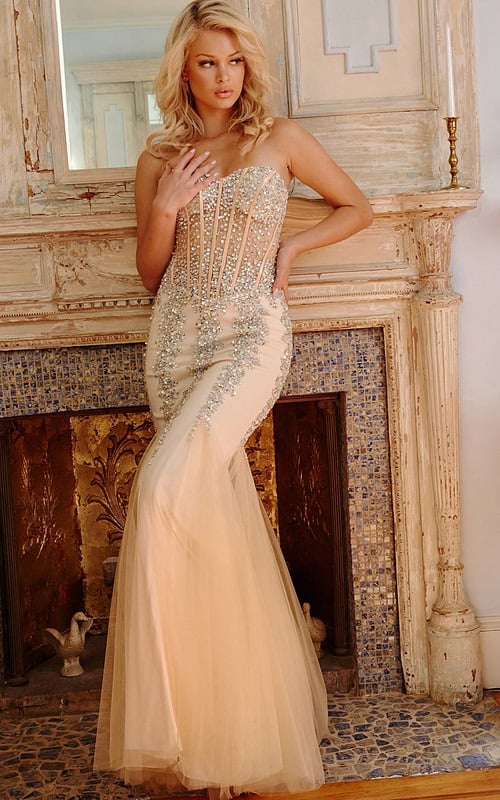 Model in Jovani 5908 beige mermaid dress with beading.