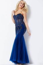 Model posing in Jovani 5908 navy dress with embellishments.