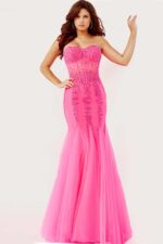 Model showing Jovani 5908 pink gown with beaded details.