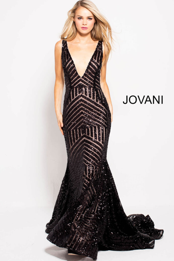 Model in Jovani 59762 black gown with striking sequin embellishments.