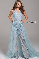 Model in Jovani 60124 light blue dress, detailed with lace appliques and flowing skirt.