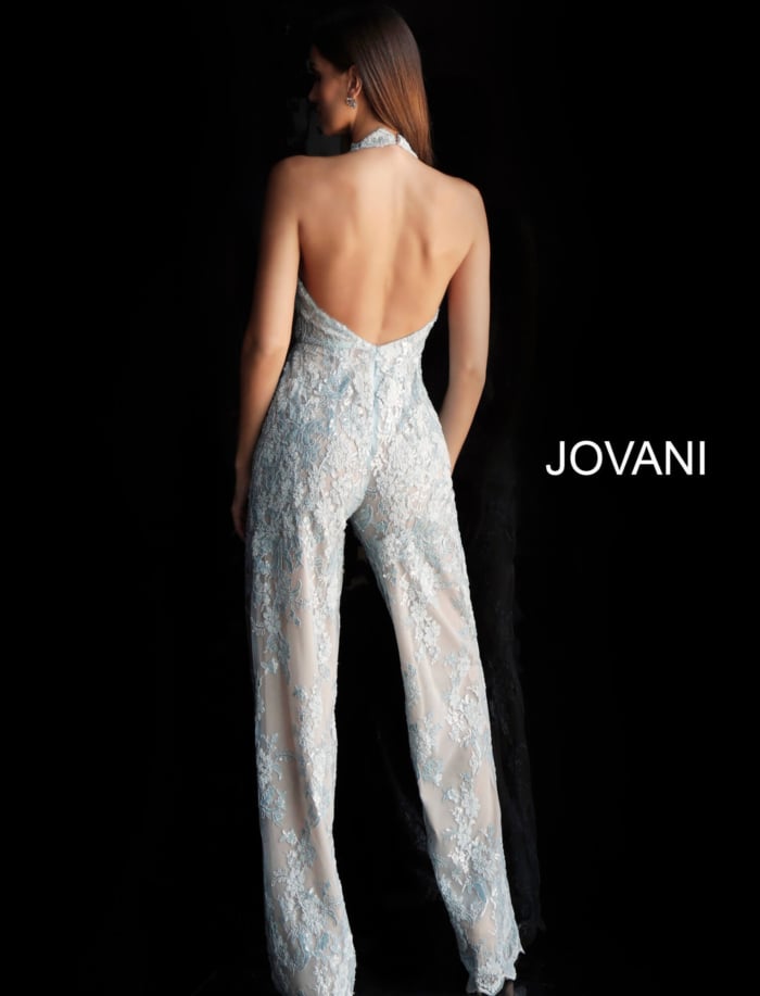 Back view of Jovani 60124 dress in light blue, showcasing open back design and sheer overlay.
