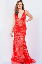 Model wearing Jovani 60283 mermaid gown in red with floral embroidery.