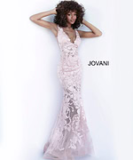 Model wearing Jovani 60283 mermaid gown in beige with floral embroidery.