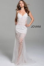 Model wearing Jovani 60695 gown in white, featuring a sheer skirt with floral applique, front view.