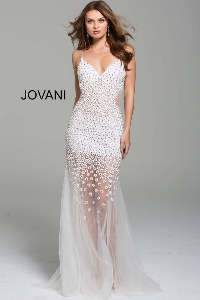 Model wearing Jovani 60695 gown in white, showcasing the floral applique details, front view.