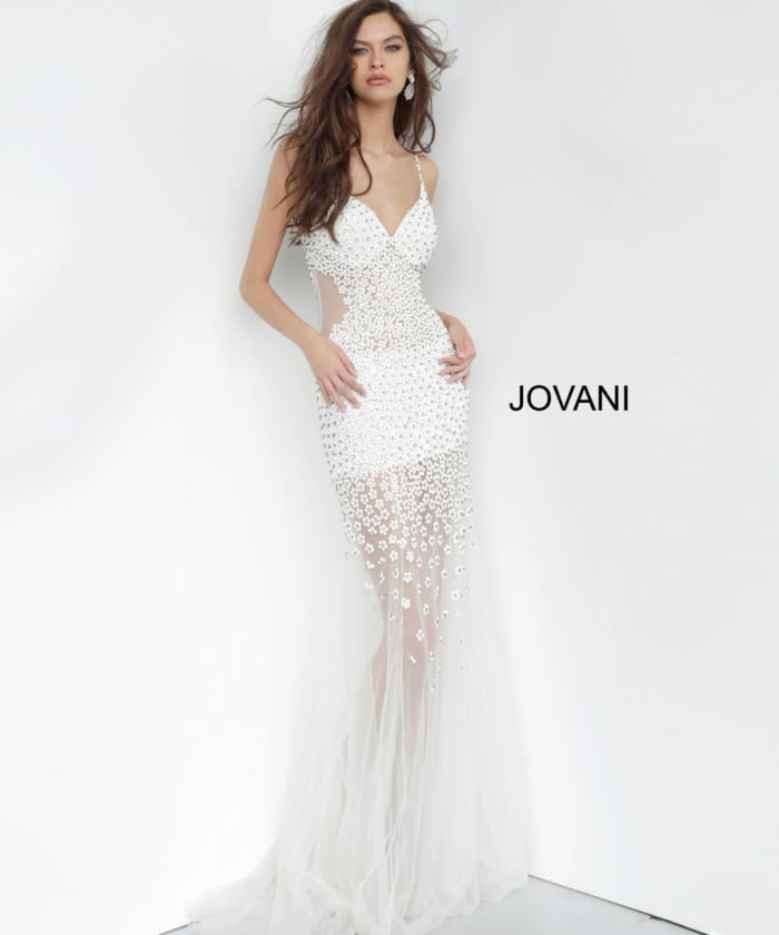 Model posing in Jovani 60695 gown in white, showcasing its elegant floral design, front view.
