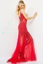 Model wearing Jovani 60695 gown in red, featuring a deep V-cut back and floral appliques.