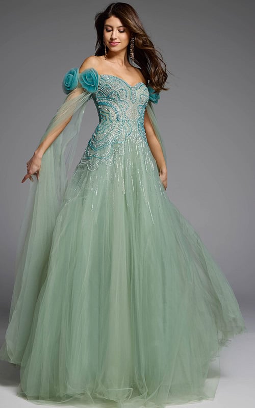 Off-the-shoulder green gown with delicate tulle cape detailing