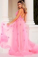 Model in Jovani 62929 viewed from the back with flowing tulle and exquisite appliqués.