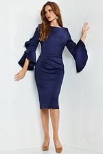 Model wearing Jovani 63169 navy dress with bateau neckline and sheath silhouette, full length front view.
