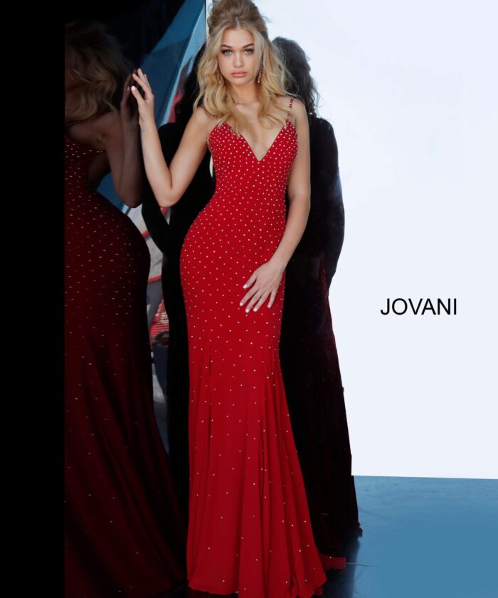 Model wearing Jovani 63563 red dress with V-neckline and sparkle, front view.