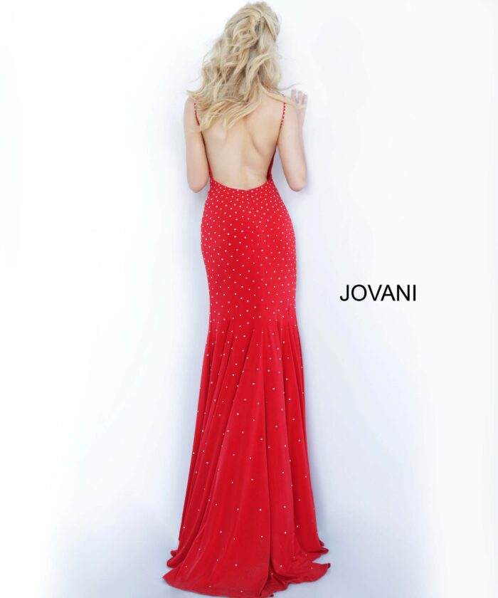 Model wearing Jovani 63563 red dress with low back and sparkling details, back view.