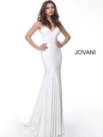 Model wearing Jovani 63563 white gown with mermaid silhouette and embellishments, front view.