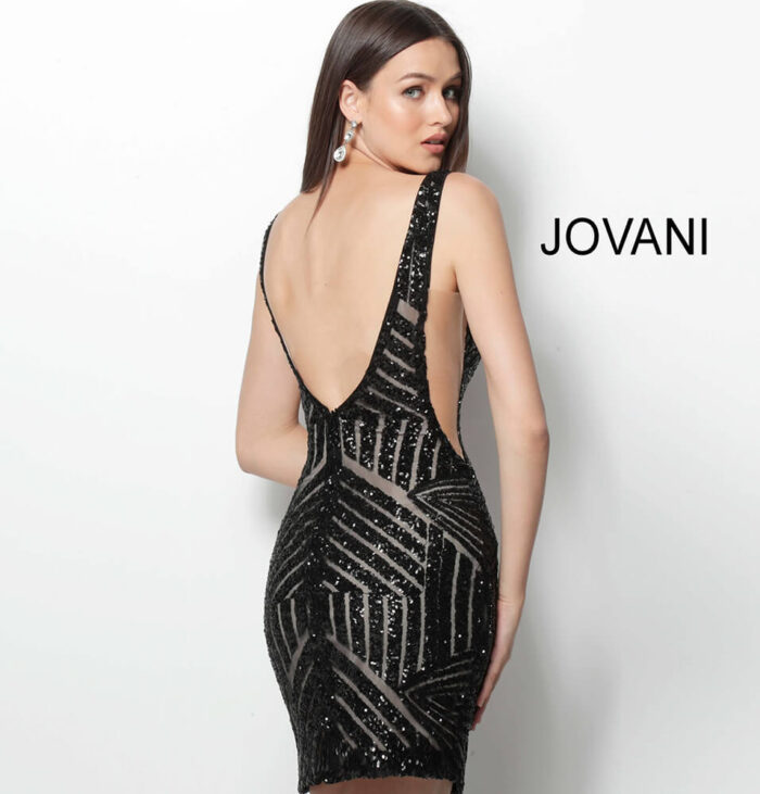 Model wearing Jovani 63899 black sequin mini dress, back view.