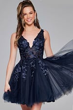 Model posing in Jovani 63987 navy dress, front view.