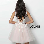 Back view of model in Jovani 63987 dress with floral details.