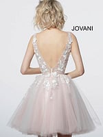 Model showcasing the back of Jovani 63987 white lace dress.