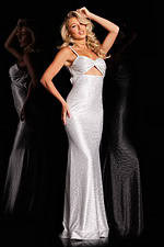 Model wearing Jovani 67632 floor-length fitted dress with cutout detail and shimmering white fabric, front view.