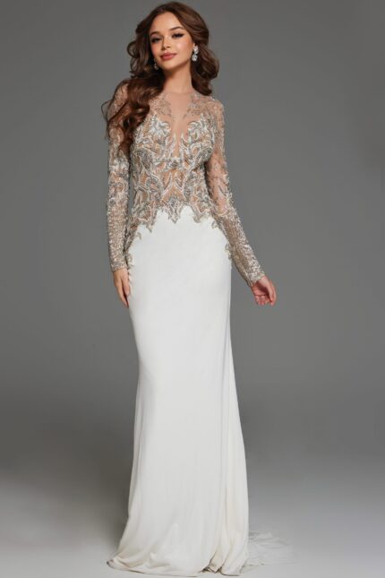 Model wearing Jovani 88983 white dress with illusion neckline and long sleeves.