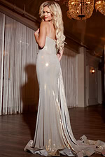Model wearing Jovani D5045 gold dress from the back, showcasing the elegant floor-length hem.