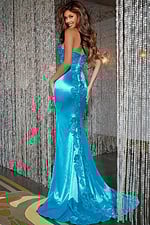 Back view of model wearing Jovani D5048 blue dress showcasing lace detailing and fitted silhouette.