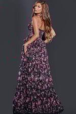 Model wearing D5065 black floral applique gown with open-back design from Jovani, back view.