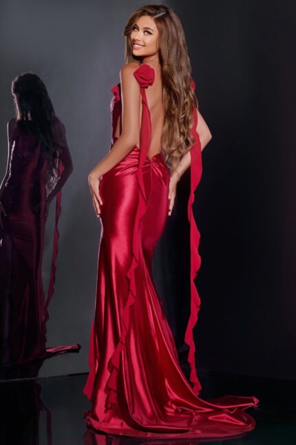 Model wearing Jovani D5078 red dress, open back view.