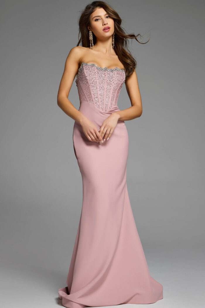 Full-length blush dress with a fitted silhouette and sparkling details.