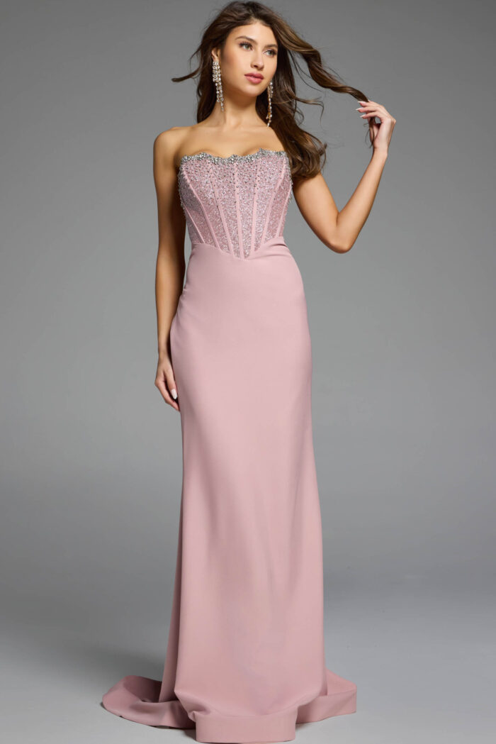 Strapless blush gown featuring a corset bodice with intricate beadwork.