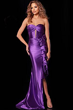 model wearing D5318 purple gown with high slit and ruffle accents