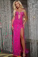 Model wearing Jovani D5724 floor-length fuchsia gown with sweetheart neckline and high slit.