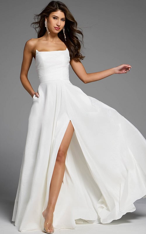 Strapless white A-line dress with slit.