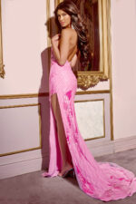 Back view of model wearing D6105 pink gown with open-back design.