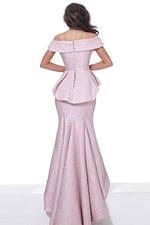 Model wearing Jovani 03944 pink gown, back view showing peplum detail