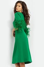 Model wearing Jovani 07341 green midi dress with feather-trimmed sleeves, back view.