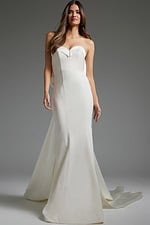 Model wearing Jovani JB05352 ivory gown with a sweetheart neckline and dramatic fit and flare design.